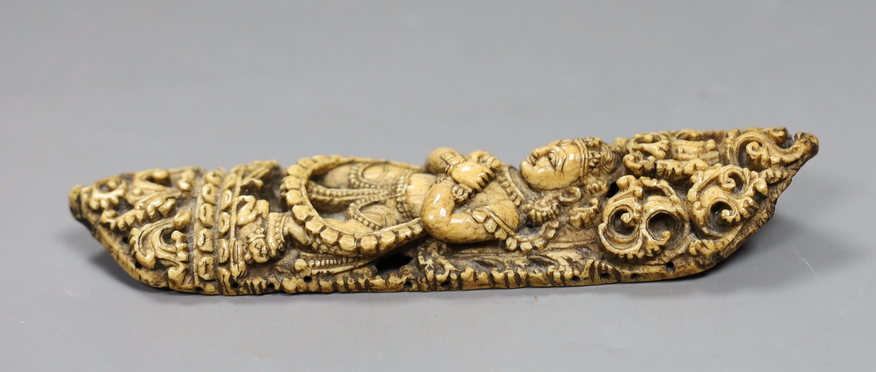 A 19th century Burmese bone carving of a Buddhist deity, 15cm tall
